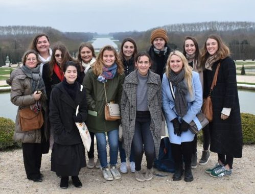 Students on the study abroad trip to Paris gathered together at Versailles