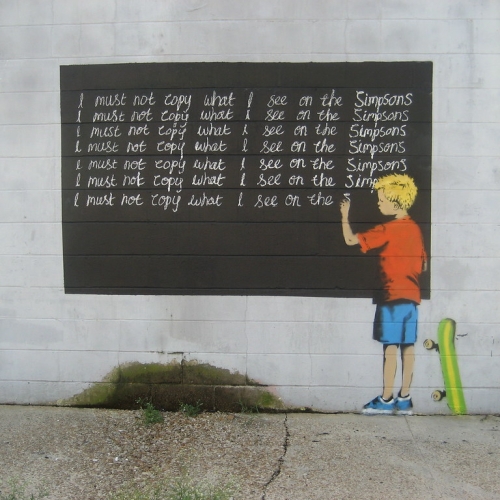 <a href="https://art.olemiss.edu/ah-357-art-now/">mural by Banksy showing a boy writing lines on a chalkboard: I must not copy what I see on the Simpsons</a>