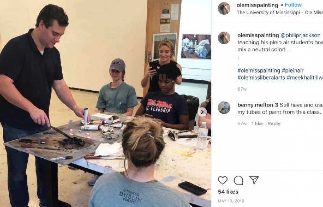 Painting Instagram post featuring a Professor teaching his plein air students how to mix a neutral color.