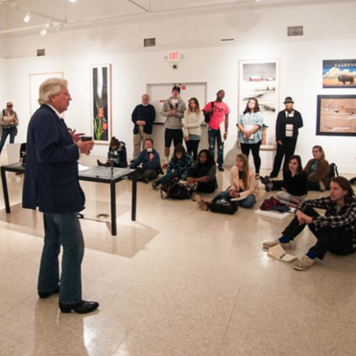 Professional artist and alumnus, William Dunlap, exhibits his work and talks with students and faculty in the department.