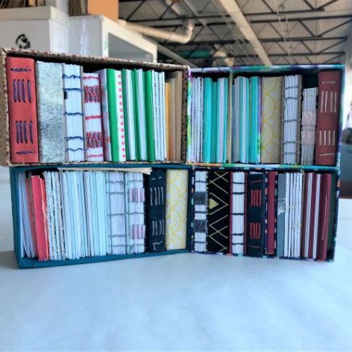 Photo of a collection of handmade books created in Art 373, Book Arts